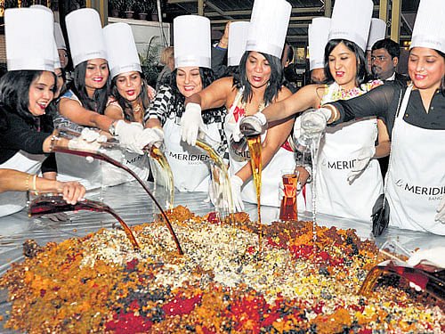 A grand cake-mixing ceremony was held at Le Meridian recently and a number of guests turned up for it. The atmosphere was cheerful as the guests wore the chef's hat and apron and helped in the mixing.