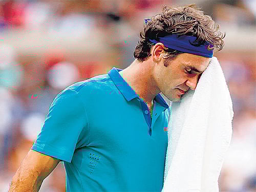 Honours were shared between France and Switzerland in the Davis Cup final in Lille on a day when Roger Federer suffered his worst ever defeat in the tournament.AP File Photo