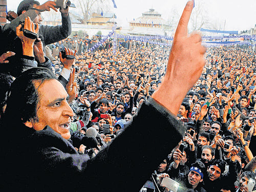 Sajjad  Lone addresses a rally in Handwara on Sunday. PTI