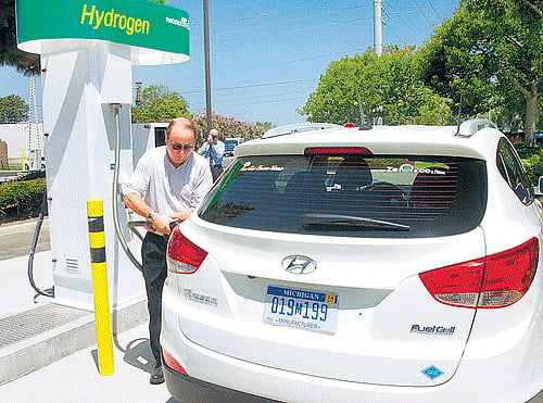 driving towards "green" future: Ed Heydorn with a hydrogen-powered Hyundai Tucson at a station in front of a wastewater-treatment plant in Fountain Valley, California. Hydrogen is generated there from human waste. nyt