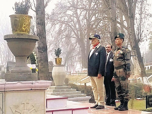 Prime Minister Narendra Modi paying tributes to the martyrs at the Badamibagh headquarters of the IndianArmyin Srinagar onMonday. PTI
