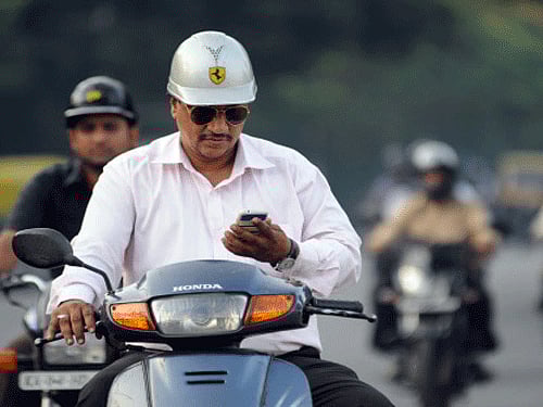 If one goes by a survey, most single Indians can't do without their mobile phones. DH photo for representation only