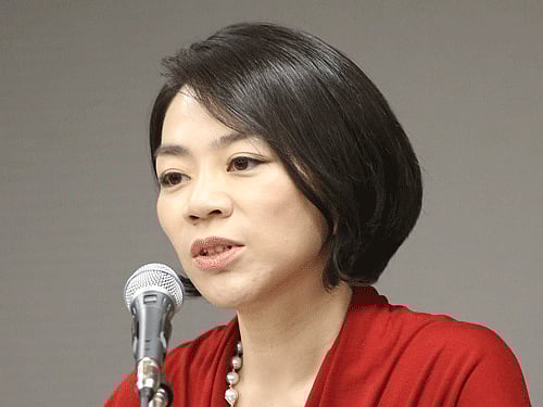 Cho Hyun-ah, Korean Air's vice president responsible for cabin service and the oldest child of Korean Air chairman Cho Yang-ho, answers reporters' question during a news conference in Incheon, west of Seoul, South Korea. Korean Air Lines apologized Tuesday, Dec. 9, 2014, for inconveniencing passengers after Cho ordered a crew member off a flight for serving bagged nuts in the first class cabin. AP Photo