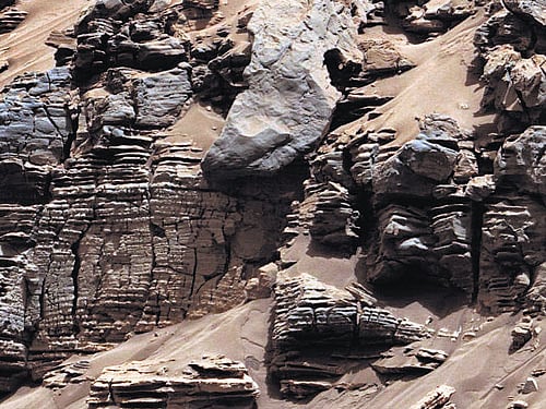 Anevenly-layered rock in a pattern typical of a lake-floor sedimentary deposit on the planet Mars is seen in this photo dated December 9, 2014. This discovery bolsters evidence that the planet is suitable for microbial life, scientists said onMonday.Reuters File Photo.