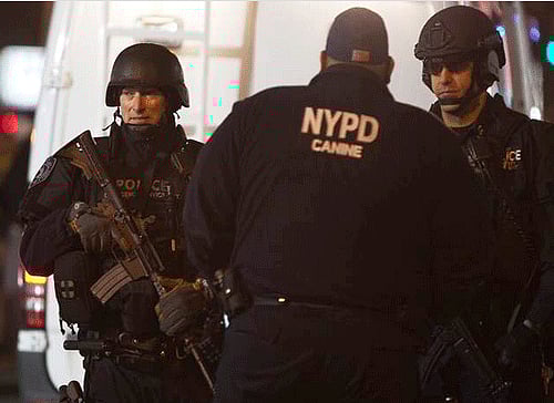 Two New York Police Department officers were shot and killed at point blank range in their patrol car here by a man who later shot himself at a nearby subway station, an attack described as an 'assassination'. Screen grab