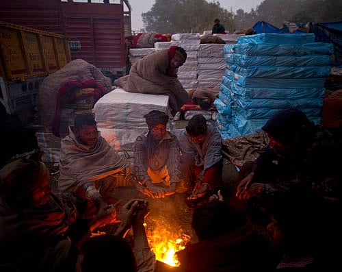 Normal life continued to be affected across North India, thanks to the intense cold wave, coupled with dense fog. AP image