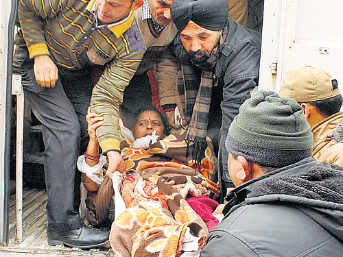 An injured civilian is taken to Government Medical College and Hospital in Jammu on Saturday. PTI