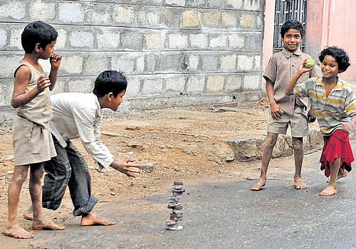 Youngsters are taking to the streets for want of open grounds. DH