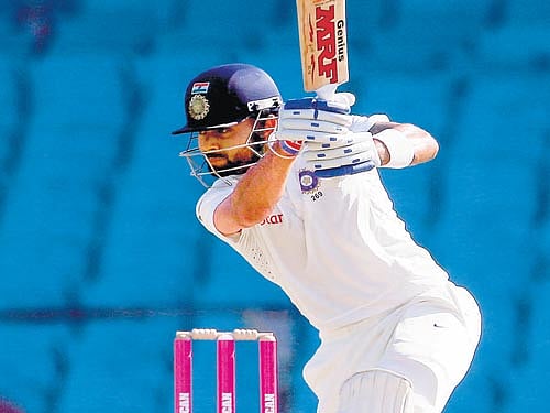 contrasting pictures: Led by Virat Kohli (left), Indian batsmen showed their mettle in the four-match Test series against Australia. But the Indian bowlers, most noticeably pacer Umesh Yadav, came a cropper Down Under. AFP/reuters