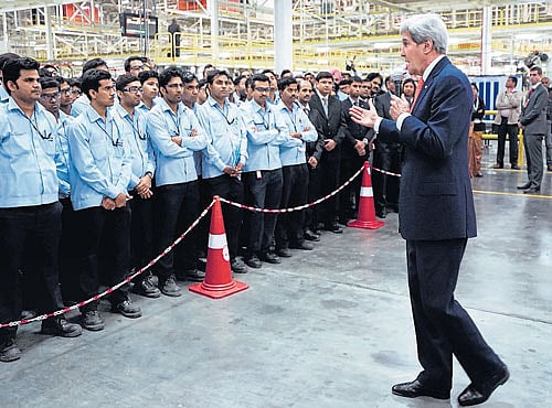 US Secretary of State John Kerry talks toworkers at a soon-to-be opened Ford India automotive factory in Sanand, Gujarat, on Monday. AP