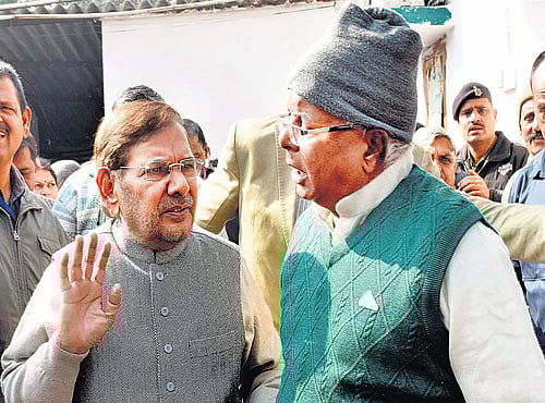 JD-U chief Sharad Yadav and RJD chief Lalu Prasad at an event in Patna onWednesday. PTI photo