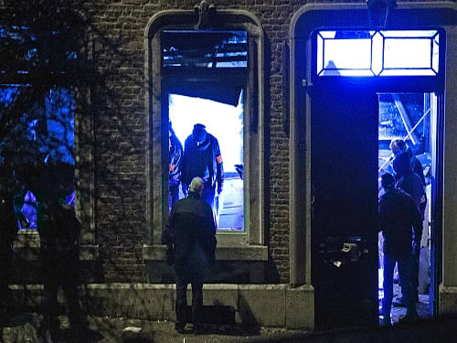 Belgian police inspect an apartment in central Verviers, a town between Liege and the German border, in east Belgium. Belgian police launched a 'jihadist-related' anti-terrorism operation in the eastern town of Verviers today, with reports saying three people had been killed. Reuters photo