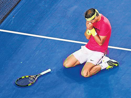 prize fighter: Rafael Nadal can't hide his emotions after fighting off injury concerns in his five-set defeat of Tim Smyczek on Wednesday. reuters