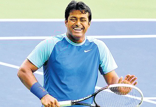 Leander Paes and Martina Hingis won their mixed doubles opener while Rohan Bopanna and Barbora Zahlavova Strycova were knocked out of the competition at the Australian Open tennis tournament here today. DH file photo