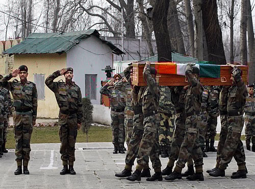 Indian Army soldiers carry a coffin of Indian army officer Col. M.N. Rai who was killed in a gunbattle Tuesday, at an army base in Srinagar. AP photo