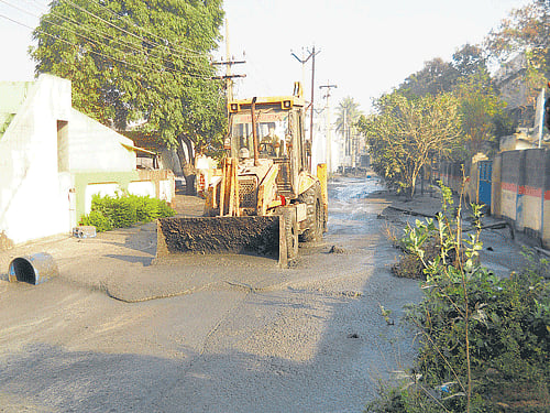 A bulldozer clears the effluent at the mishap site at Ranipet in the Vellore District of Tamil Nadu on Saturday. DH photo