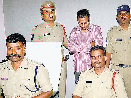 Sayed Zakir Husain (centre), a police head constable at IDA Bollaram, and his wife Raziya Sultana (not in picture) are accused of torturing and killing Shahista Sabah, a five-year-old girl they brought from Gulbarga five months ago.  Mohammed Arif