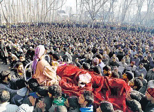 Villagers carry body of Farooq Ahmad Bhat, a civilian killed in security forces' firing, in Srinagar on Tuesday. REUTERS