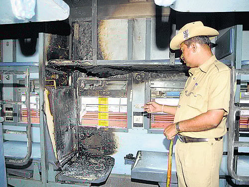Disfigured: The interiors of the coach of the Bhubaneswar-Yeshwantpur Superfast Express that caught fire at the Yeshwantpur railway station on Monday. DH PHOTO