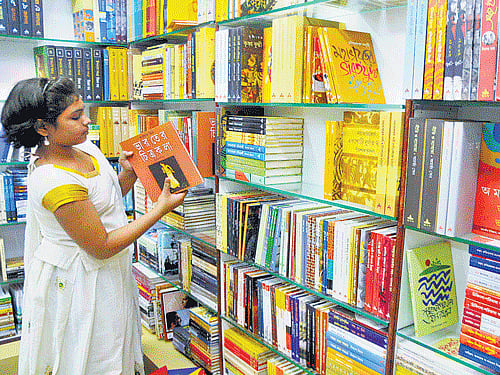bookworm A visitor browses books at Bengaluru's first Bengali book store at Sultanpalya in RT Nagar. DH PHOTO
