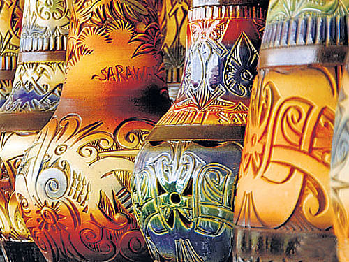 collector's items 'batik' scarf, Sarawak pottery.