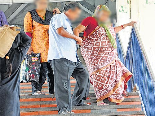 INCONVENIENT Better facilities, like the ramp at the entrance of the City Railway Station, are needed for the disabled to get from one platform to another. DH photo by Janardhan BK