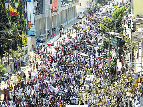 demanding answers: The massive rally organised by Vokkaligara Sangha triggered traffic jams on the busy JC Road and surrounding areas in Bengaluru on Friday. As the procession entered JC Road, vehicular movement came to a halt. Traffic was affected even at Anand Rao Circle, Seshadri Road, KR Circle, Hudson Circle and Palace Road. The police had deployed additional traffic personnel at various intersections and junctions to guide road users. DH photo