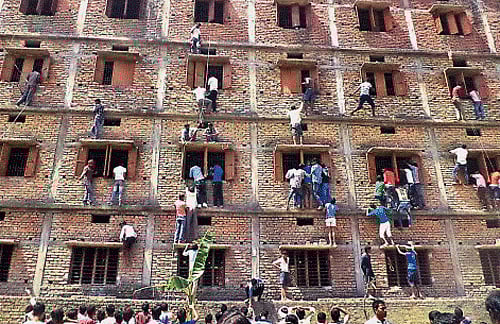 A day after being reprimanded by the Patna High Court, the Bihar government today enforced a crackdown and apprehended over 900 people, including students and parents, from different exam centres in the state for cheating in the ongoing matriculation examination. PTI photo