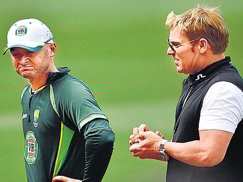 legend's tips Australian skipper Michael Clarke discusses a point with former leg-spinner Shane Warne. reuters