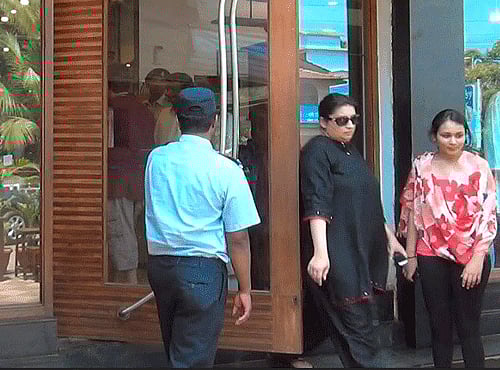 HRD Mnister Smriti Irani coming out of a showroom where she found a camera installed inside the changing room, at Candolim, Goa on Friday. PTI Photo