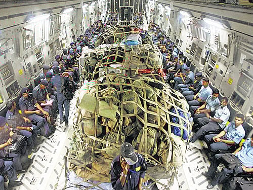 Indian Air Force and National Disaster Response Force personnel on their way to&#8200;Nepal on Monday. PTI