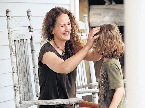 Angie Firmalino with her son Elijah, 5, in Tannersville, New York on Friday. NYT