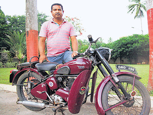 Two-wheeler collector Gahar Abedin with one of his motorbike in Bhubaneswar.