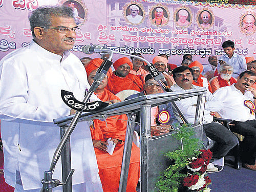 Dharmasthala Dharmadhikari D Veerendra Heggade speaks at the inauguration of Sri Lingarajendra Prasada Nilaya, on the occasion of birth centenary celebrations of Sri Shantamallaswami and tricentennial celebrations of Arameri Kalancheri Mutt near Virajpet on Saturday. Dh photo