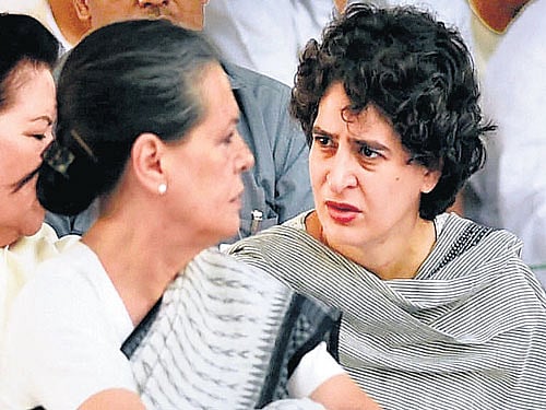 Congress president Sonia Gandhiwith daughter Priyanka Vadra at a prayer meeting on former Prime Minister Rajiv Gandhi's 24th death anniversary at his memorial 'Vir Bhumi' in NewDelhi on Thursday. PTI