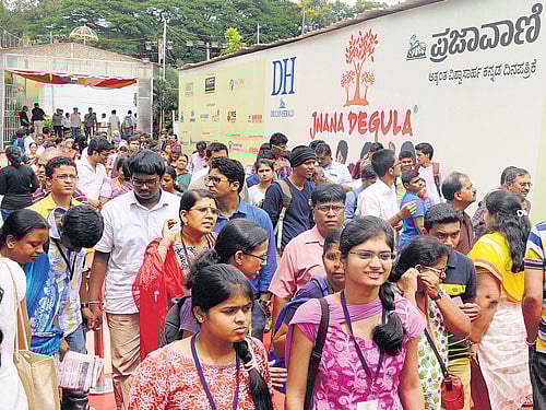 Students throng stalls at the event.