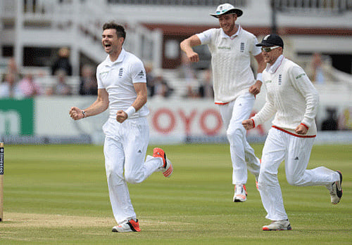 England's James Anderson, Stuart Broad and Joe Root celebrate after the dismissal of New Zealand's Martin Guptill . Reuters photo