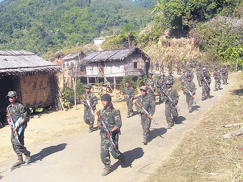 Afile picture of a bannedManipur militant group cadres patrolling in a remote location on the Indo-Myanmar border.