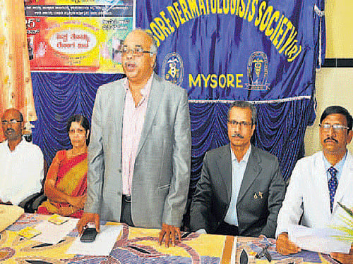 Medical Superintendent, K R Hospital, Dr B G Sagar addresses the gathering during World Vitiligo Day, in Mysuru on Thursday. Medical Superintendent, Cheluvamba Hospital, Dr Radhamani, HoD, Dermatology, Mysore Medical College and Research Institute, Dr B L  Nanjunda Swamy, president, Mysore Dermatology Society, Dr Y M Shivkumar and secretary Dr K A K Surendran are seen. DH photo