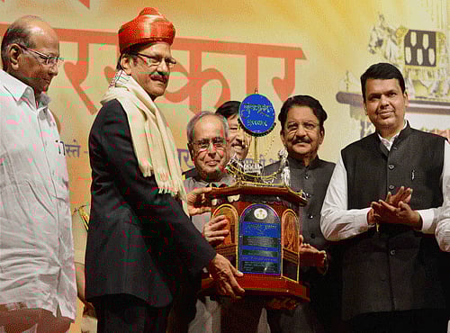 President Pranab Mukherjee presents the Punyabhushan Award to Prataprao Pawar in presence of Maharashtra Governor CV Rao and Chief Minister Devendra Fadnavis and NCP Chief Sharad Pawar in Pune on Friday. PTI Photo