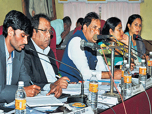 District in-Charge Minister K J George chairs KDP review meeting in Madikeri on Friday. DH photo