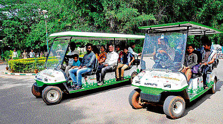 smoke-free: Visitors move around at Cubbon Park in eco-friendly vehicles on Sunday. DH photo