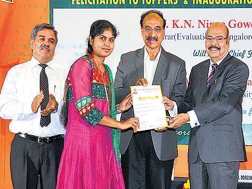 A student being felicitated.