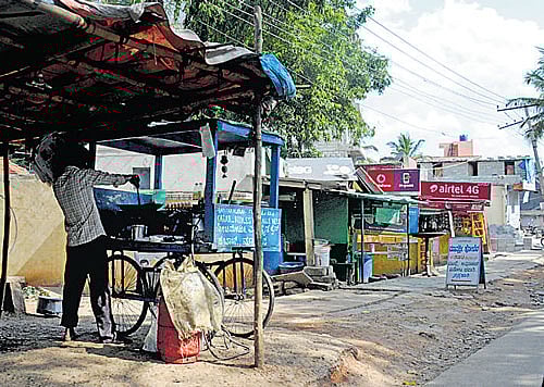 A footpath encroached upon at Talaghattapura in Hemmigepura ward. DH