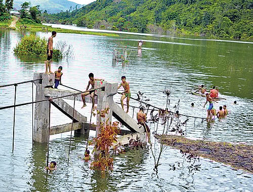 A bridge in Chadong village of Ukhrul district in Manipur, inhabited by the Thunkul Nagas, has been submerged for almost a month by the rising waters of the Mapithel dam of the Thoubal Multipurpose Project.  DEEPAK OINAM