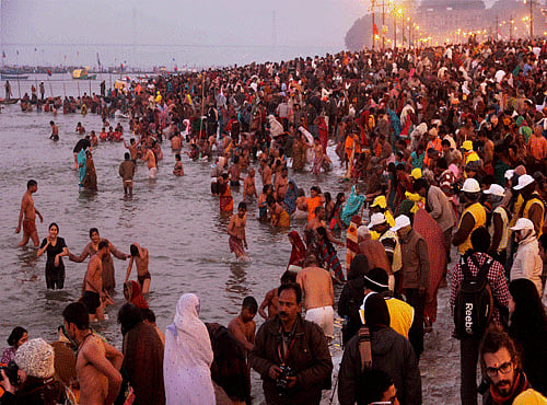 Devotees taking holy dip at Maha Kumbh, PTI file photo