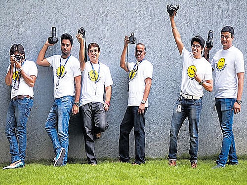 explorers Professionals at the 'Smiles of Virtusa' initiative and (below) employees of Virtusa sharing a light moment.