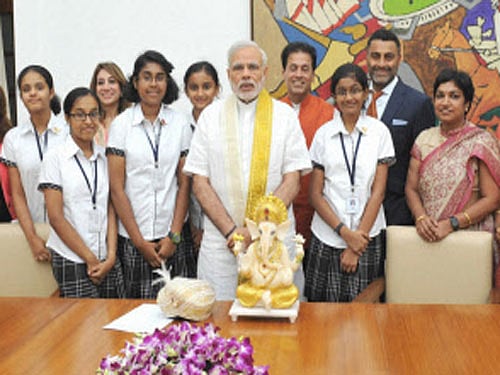 Modi with the students of New Horizon Public School. PTI