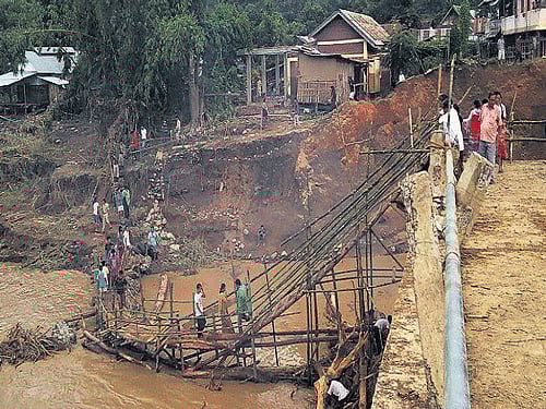 The temporary bridge built by villagers after Chakpikarong bridge - that serves more than 40,000 people of both Thoubal and Chandel districts of Manipur- collapsed on July 31 due to flash floods. DEEPAK OINAM