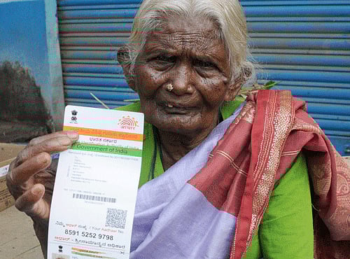 80 year old siddamma showing her Aadhar Card. DH file photo
